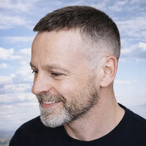 Messy French crop haircut for receding hairline with short faded sides and textured top, modern men’s hairstyle.