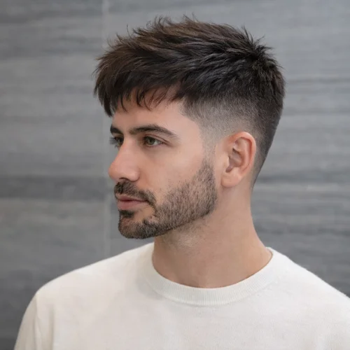 modern men’s haircut with longer top and neat sides