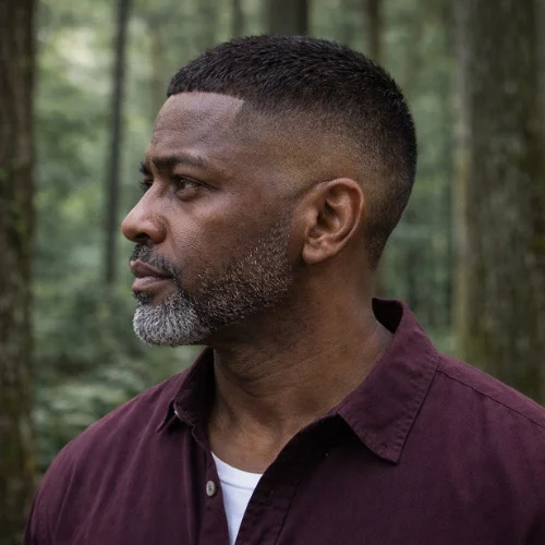 Older man with buzz cut French crop burst fade hairstyle in forest